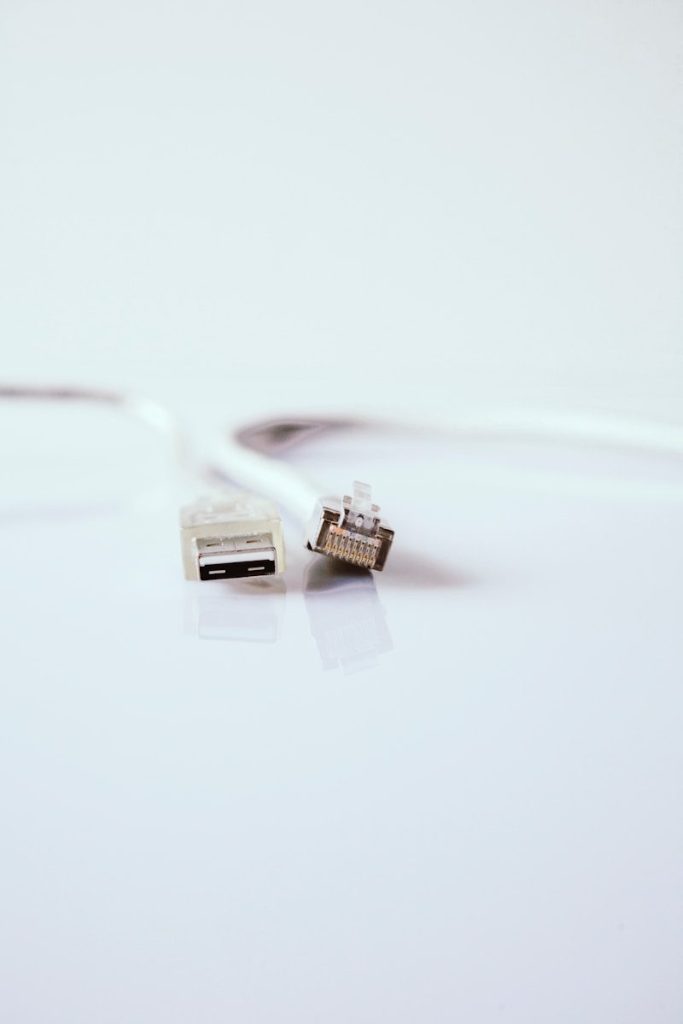 white usb cable on white surface